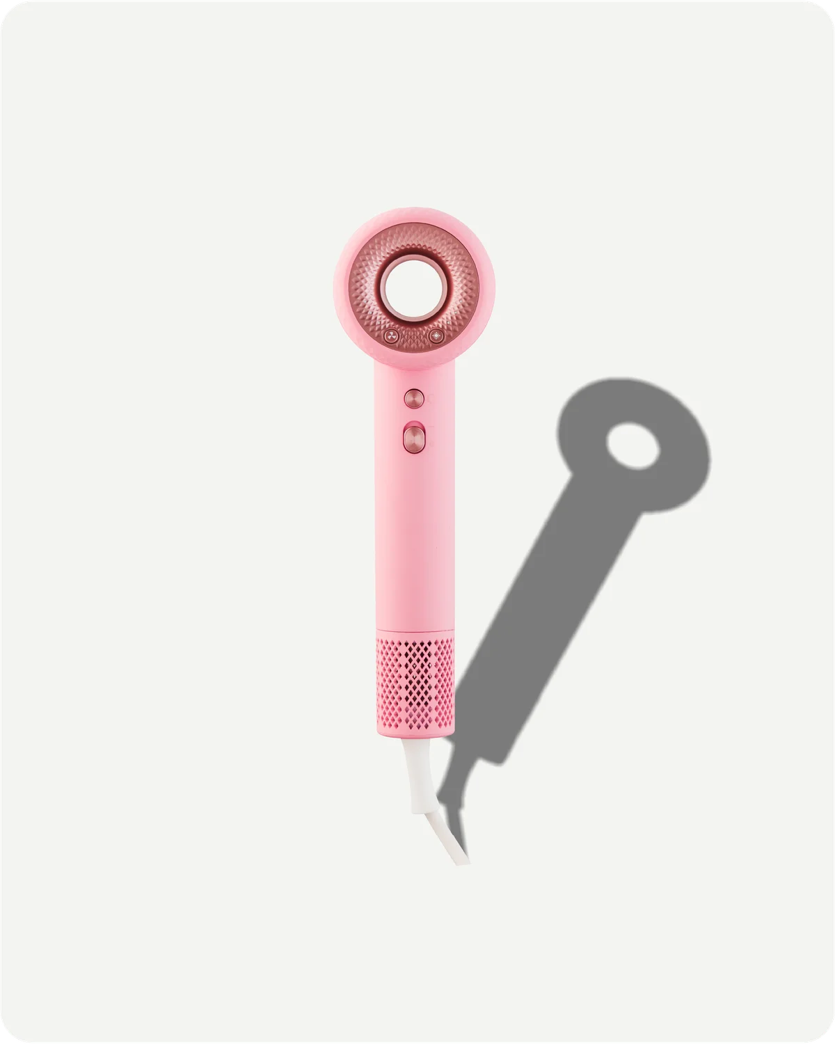 Pink hair dryer on a white background