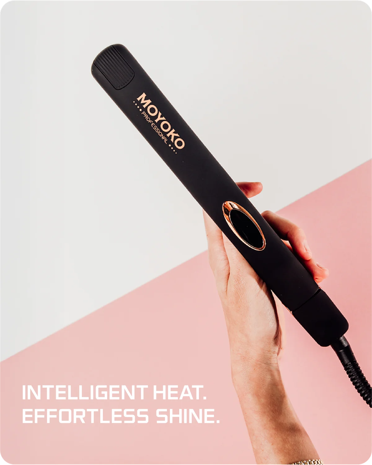 Black hair straightener with 'Moyoko' branding held by a hand on a pink and white background.