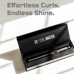 Curling iron in a black box with '32 Curl Master' branding on a light background.