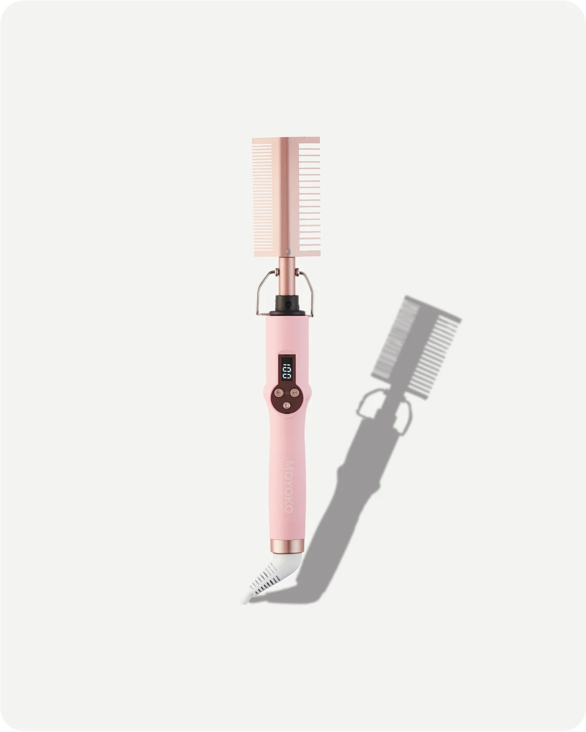 Pink hair straightening iron comb with digital display on a white background