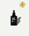 Black bottle of kroma 10 in 1 leave in treatment with a spray nozzle on a white background, featuring the Glamour Beauty Awards 2025 logo.