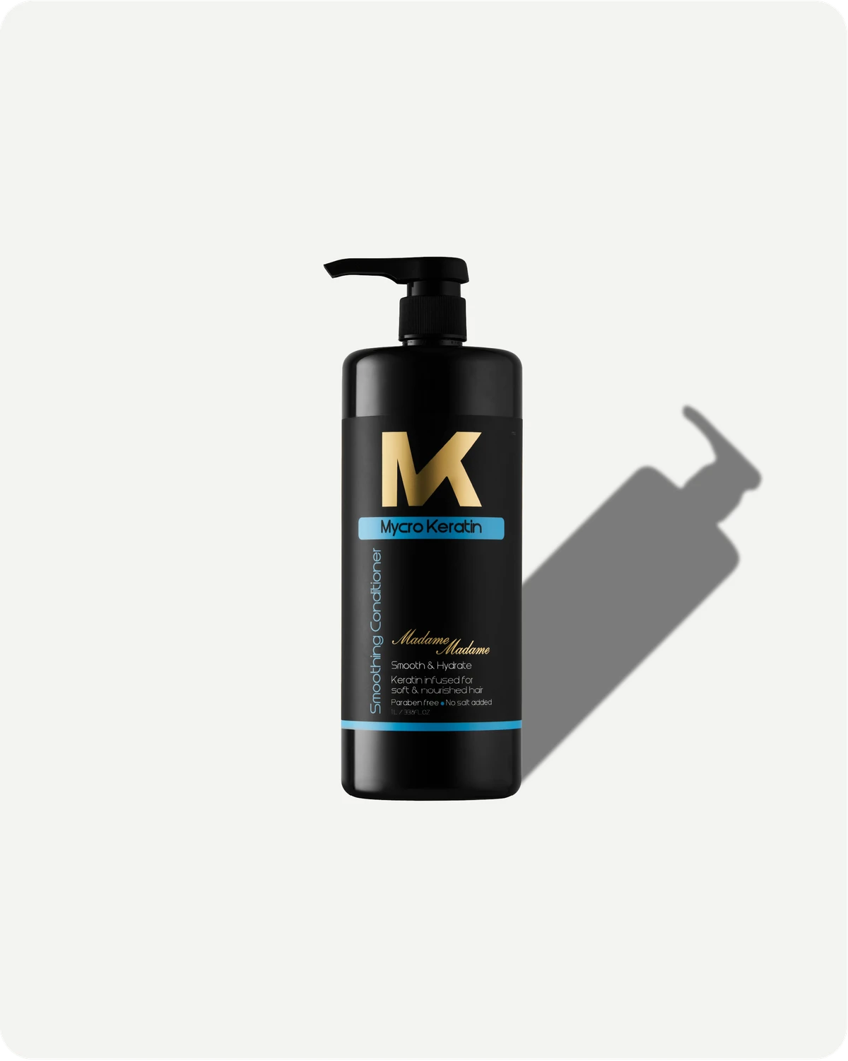 Madame conditioner bottle with pump and 'MK' logo on a white background