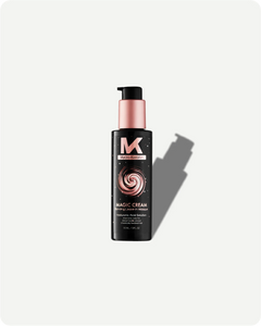 Black bottle of Magic Cream with pink pump on a white background
