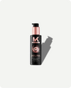 Black bottle of Magic Cream with pink pump on a white background