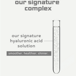 Test tube with clear liquid labeled 'our signature hyaluronic acid solution' on a light gray background.