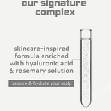 Skincare-inspired formula with hyaluronic acid and rosemary solution in a test tube on a light gray background.