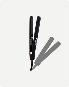 Black hair straightener with rose gold accents on a white background