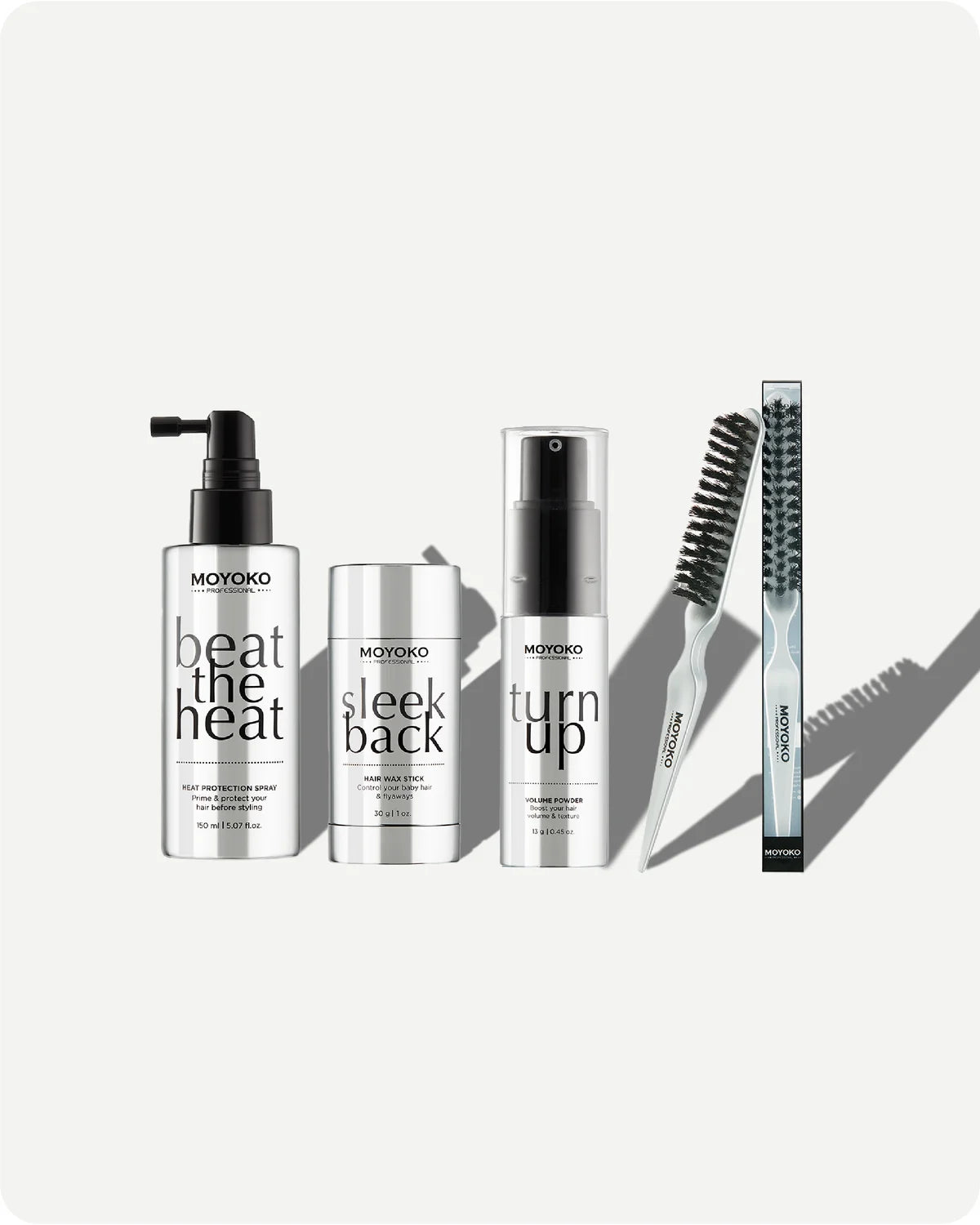 Set of Moyoko hair care products including beat the heat, sleek back, turn up and sleek brush, on a white background