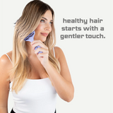 Woman using a hairbrush with text 'healthy hair starts with a gentler touch' on a white background