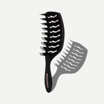 Black hairbrush with bristle design on a white background