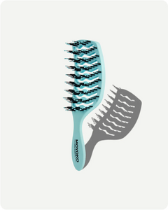 Blue hairbrush with black bristles on a white background