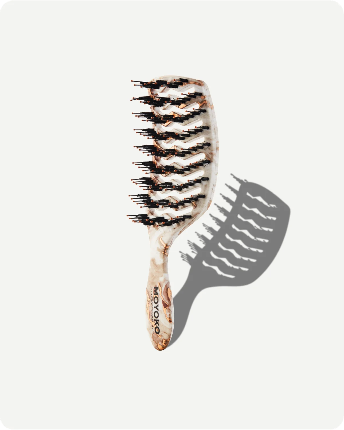 Hairbrush with tortoiseshell pattern on a white background