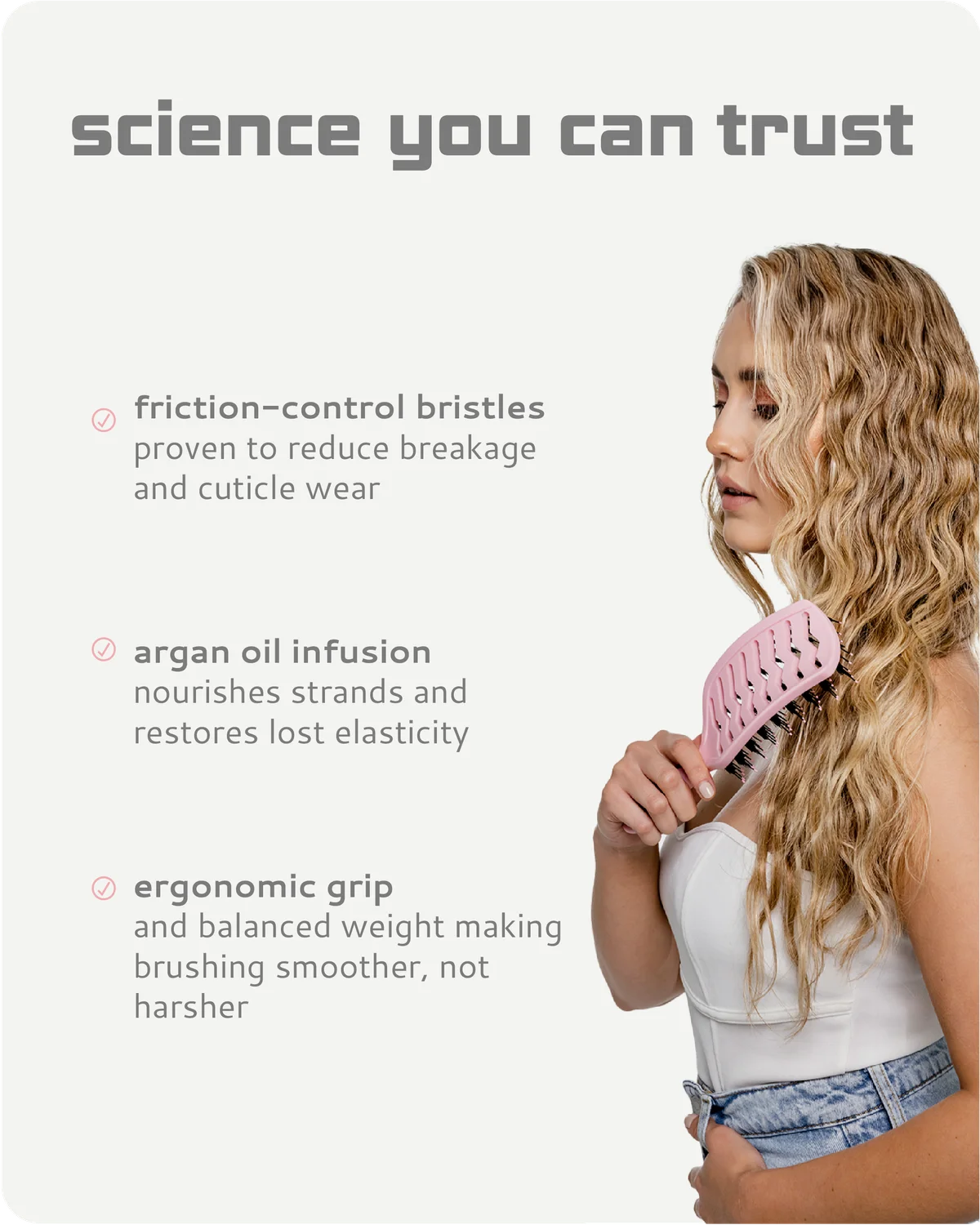 Woman brushing her hair with a pink brush, featuring text about product features on a white background.