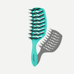 Turquoise hairbrush with black bristles on a white background