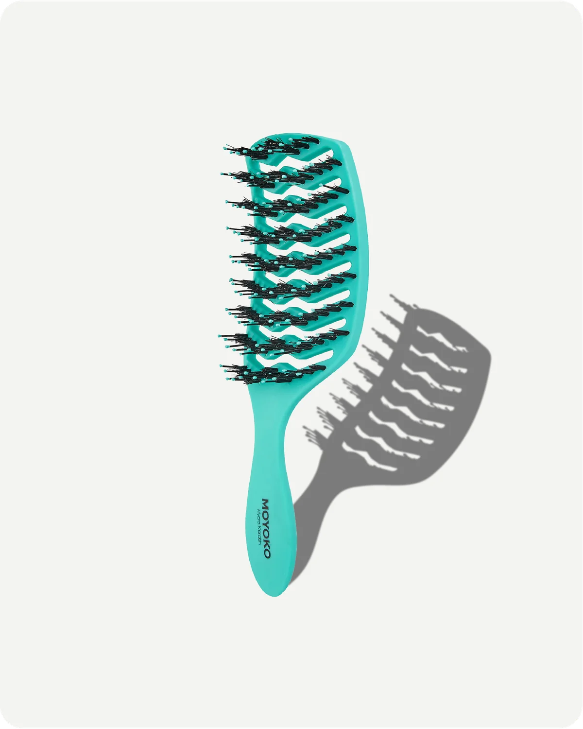Turquoise hairbrush with black bristles on a white background