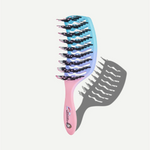Gradient hairbrush with pink handle and blue bristle head on a white background