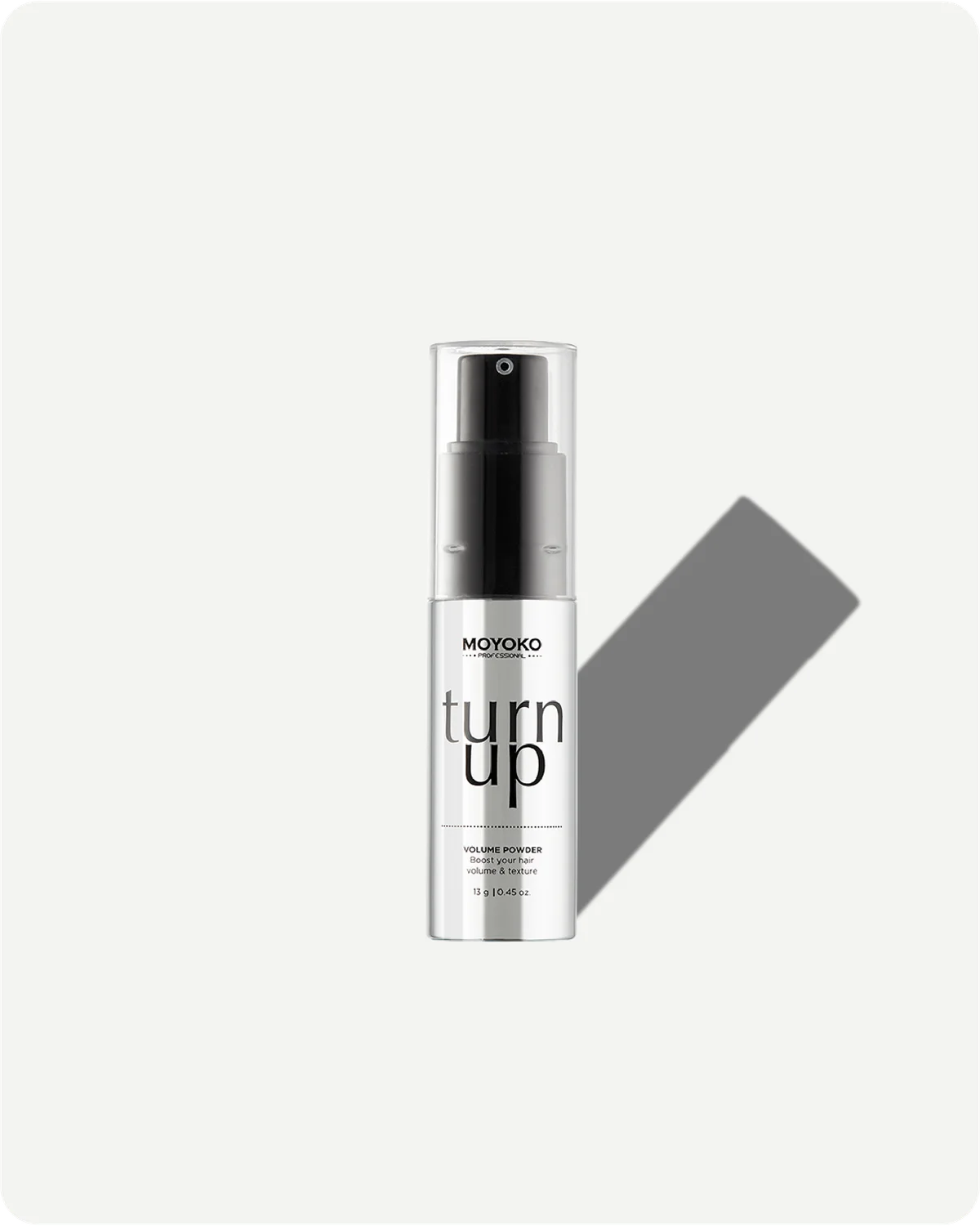 spray bottle labeled 'turn up' by MOYOKO on a white background