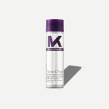 Tone and Treat conditioner bottle with purple cap and white label on a light gray background